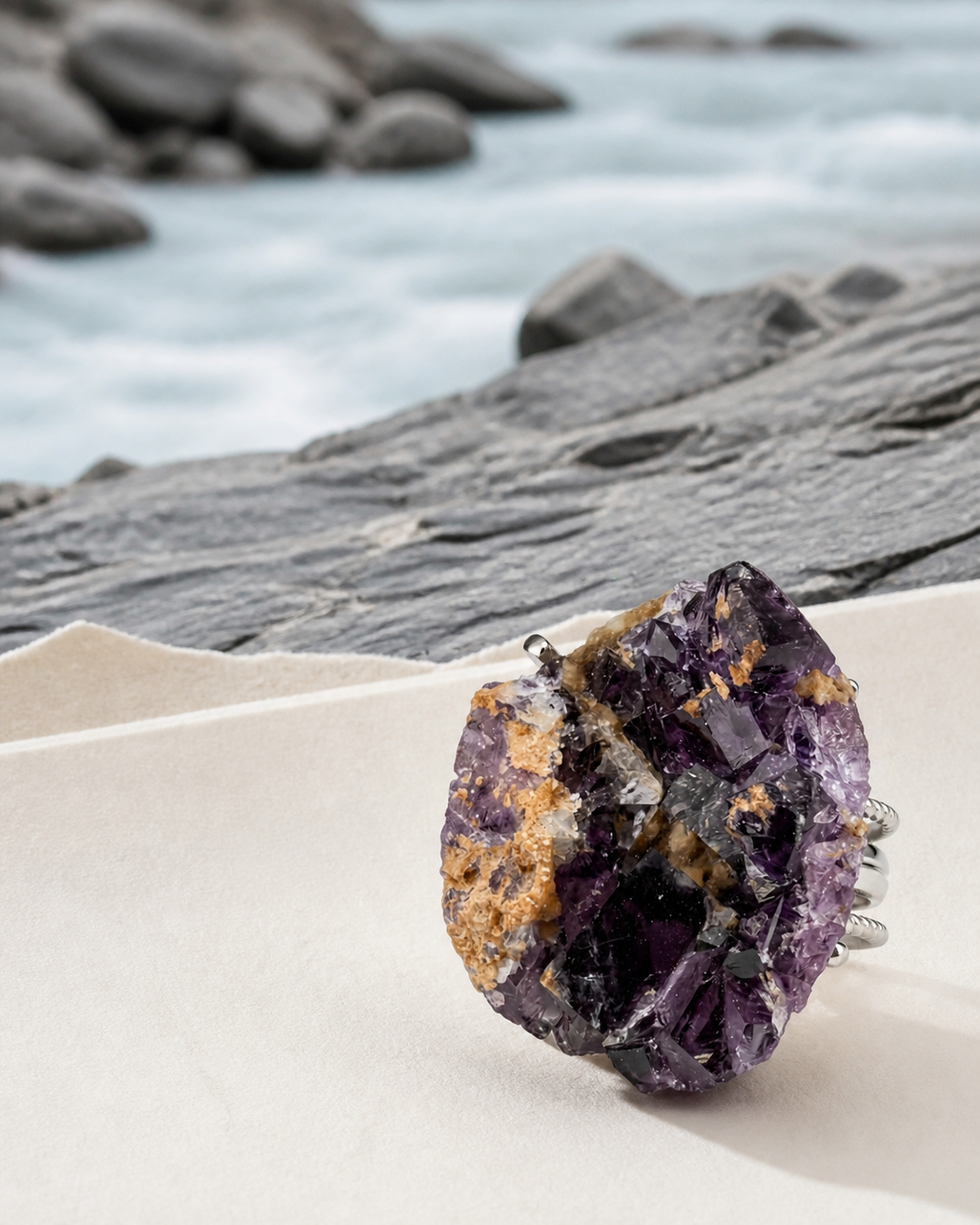 Violet raw mineral ring displayed as a material study